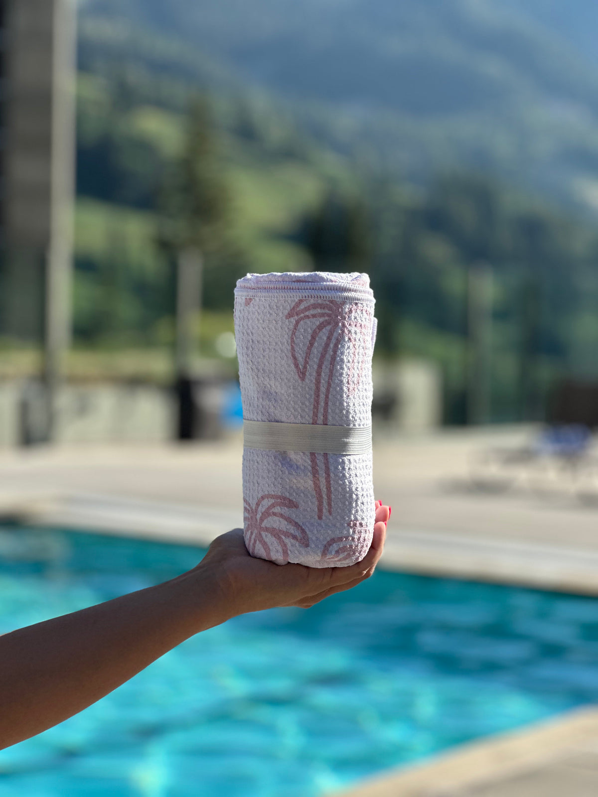 Pink Stripe Pool Towel: Reversible, rolled with elastic band by the pool